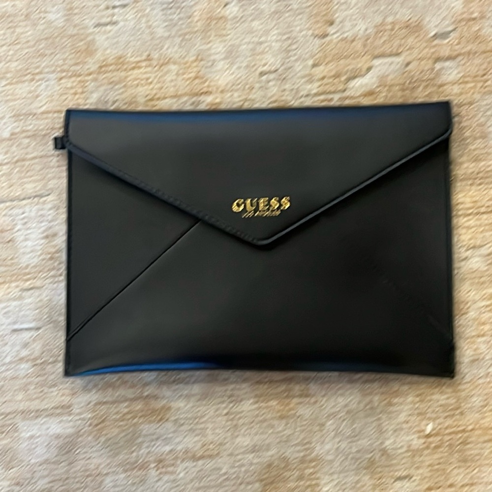 Guess black clutch. Excellent condition